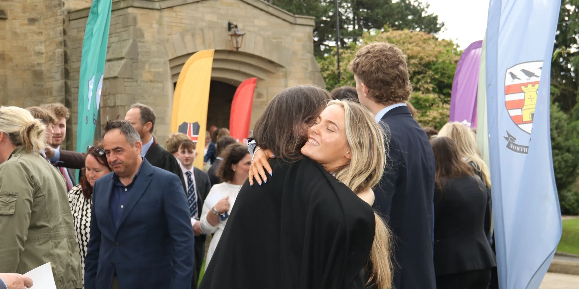 Barnard Castle School pupil hugging someone