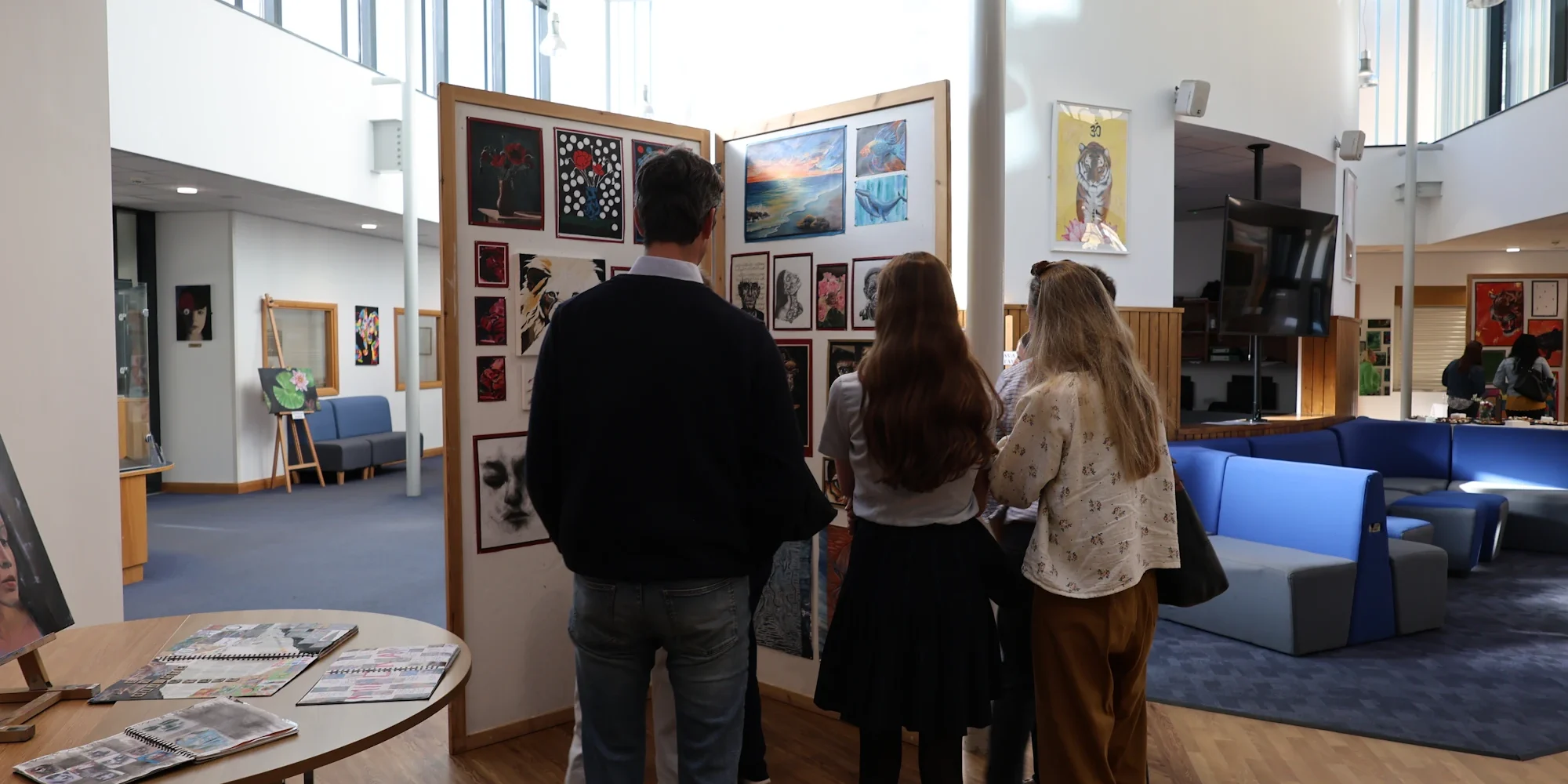 Barnard Castle School parents at an art exhibition.