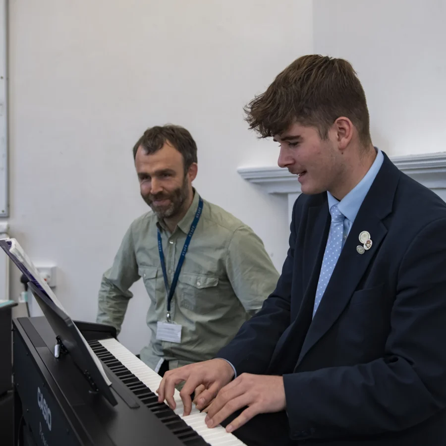 Barnard Castle School pupil having a piano lesson.