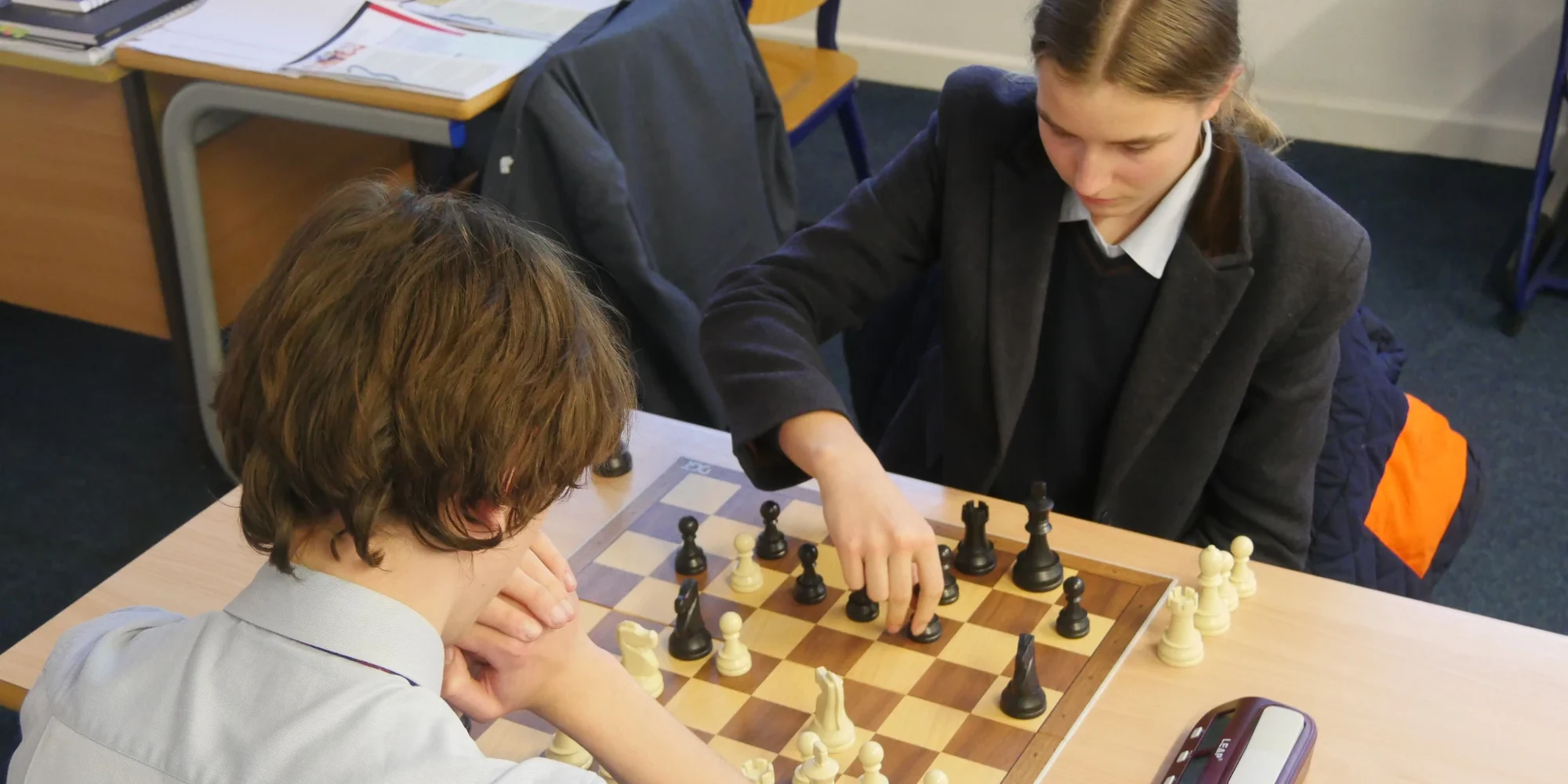 Barney students playing chess.