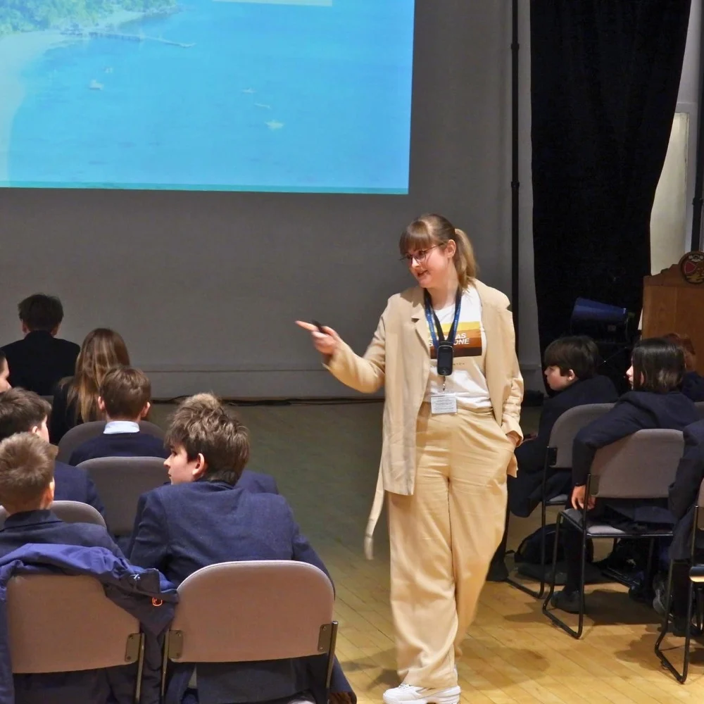 An Old Barnardian delivering a presentation to students.