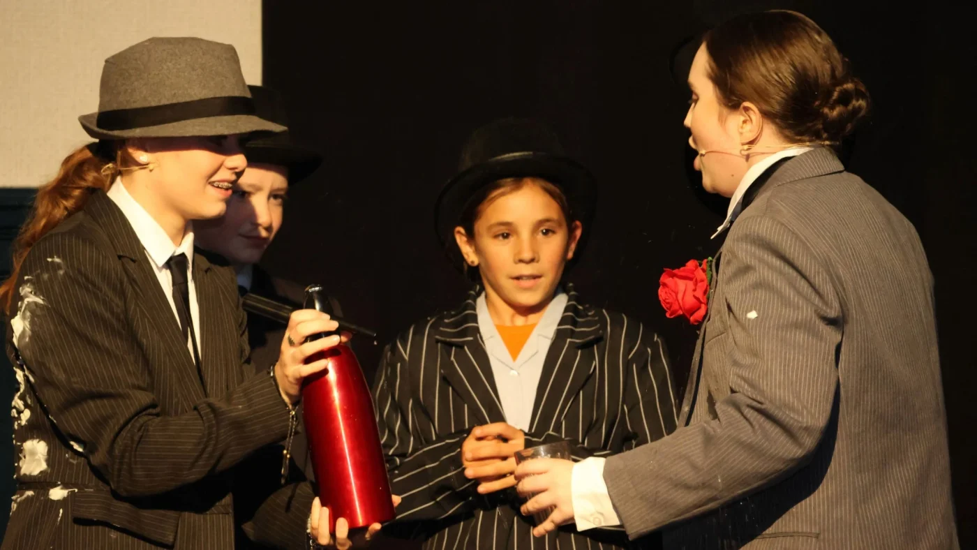 Barney students in period costumes performing.