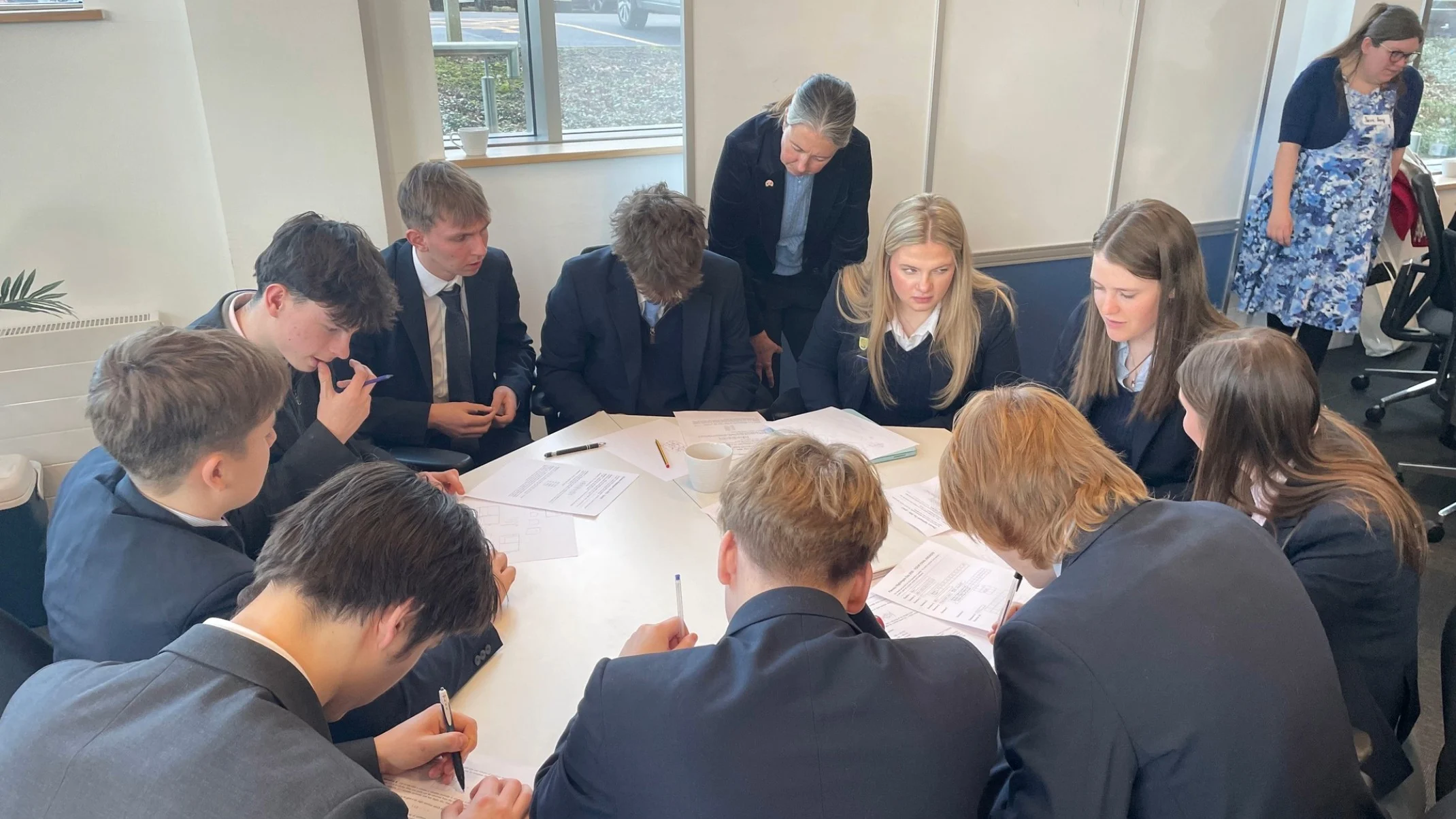 A group of Barney students sat around a table at Lancaster University.