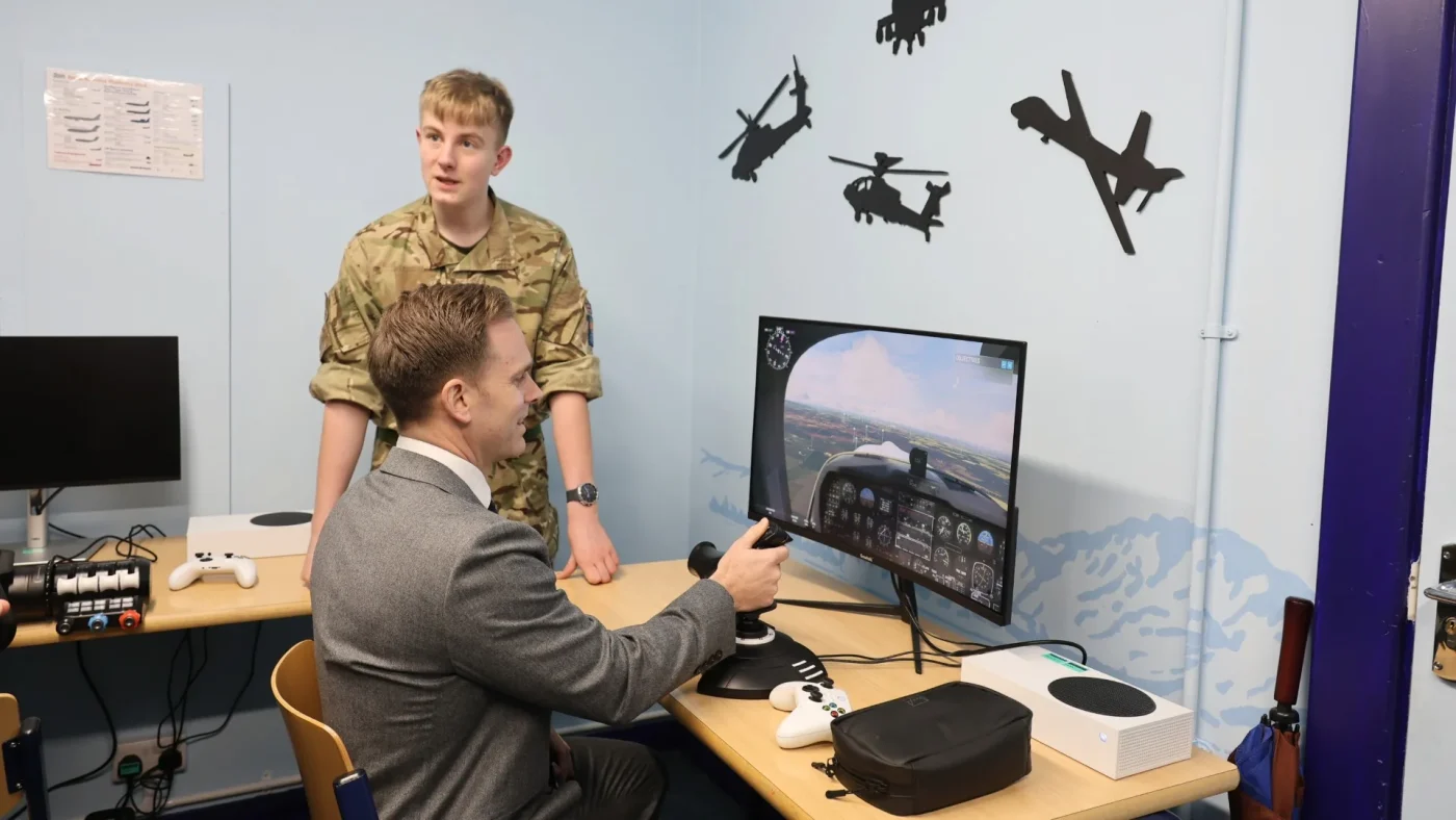 Headmaster David Cresswell and Cadets in Barnard Castle School's new RAF simulator room.