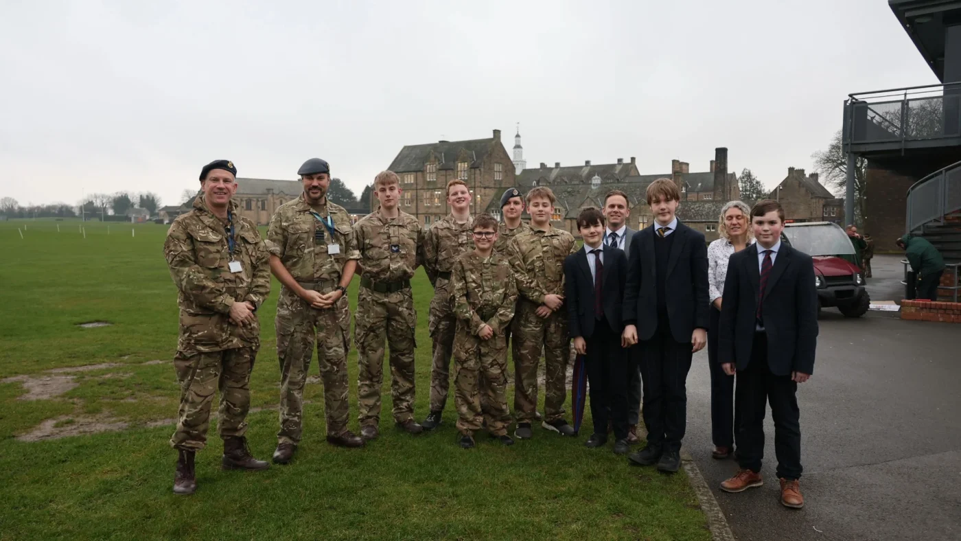 Cadets, military, and school staff standing outside Barnard Castle School.